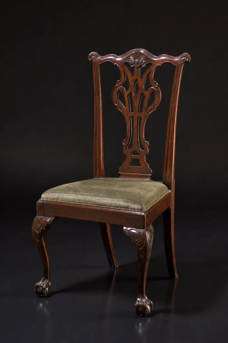 An antique mahogany Chippendale chair photographed against a dark background, as catalogued in a chattels valuation